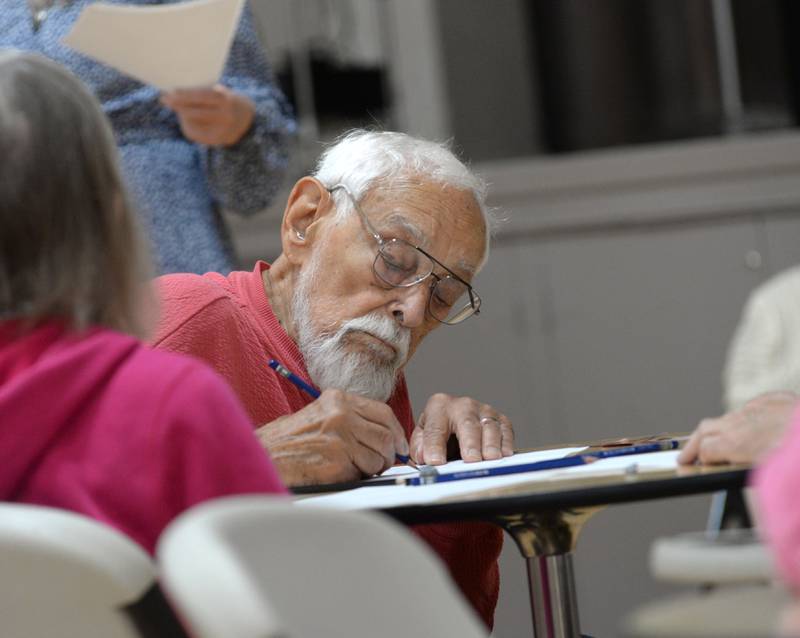 Joe Popp of Oregon works on his suspect sketch during a workshop by retired forensic artist Bethe Hughes of Dixon at the Coliseum Museum of Art, Antiques, and Americana in Oregon on Saturday, Aug. 17, 2024.