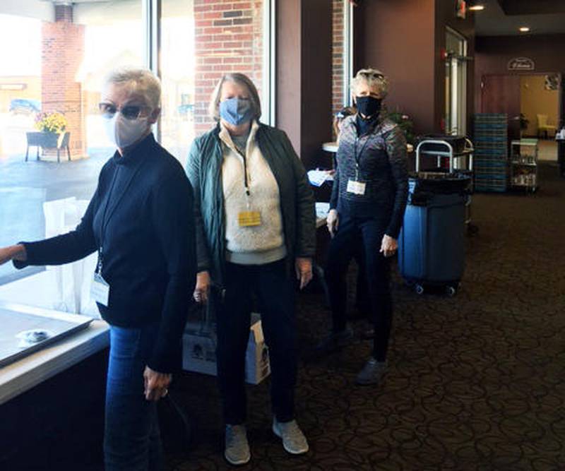 Elks members Linda Wiggins, Pam Blickem and Patricia McAdams pack lunches for area veterans on Veterans Day.