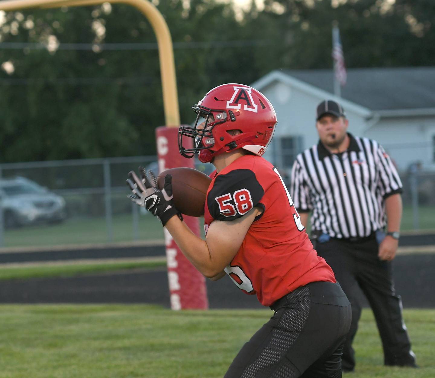 Amboy's Vincent Zembrzuski catches a pass from Tucker Lindenmeyer for a touchdown against Milledgeville on Friday. Sept. 9.