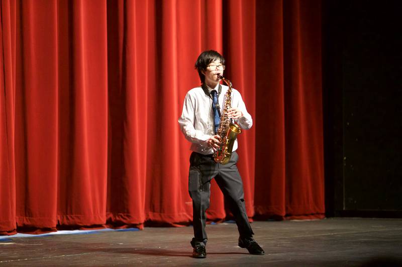 Mr. Kaneland contestant Jimmy Kaphengst plays the saxophone perform during Mr. Kaneland contest on Friday, March 15, 2024 at Kaneland High School in Maple Park.