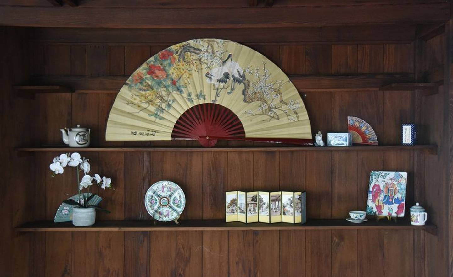 Items on display in the teahouse within the Japanese Tea Garden at Fabyan Forest Preserve in Geneva. They came from the collection of the late Darlene Larson, founder of the Friends of Fabyan, who led earlier restorations of the garden.