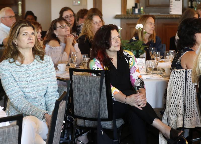 People listen as award recipient Dianna Torman speak during the Northwest Herald's Women of Distinction award luncheon Wednesday June 5, 2024, at Boulder Ridge Country Club, in Lake in the Hills. The luncheon recognized 11 women in the community as Women of Distinction.