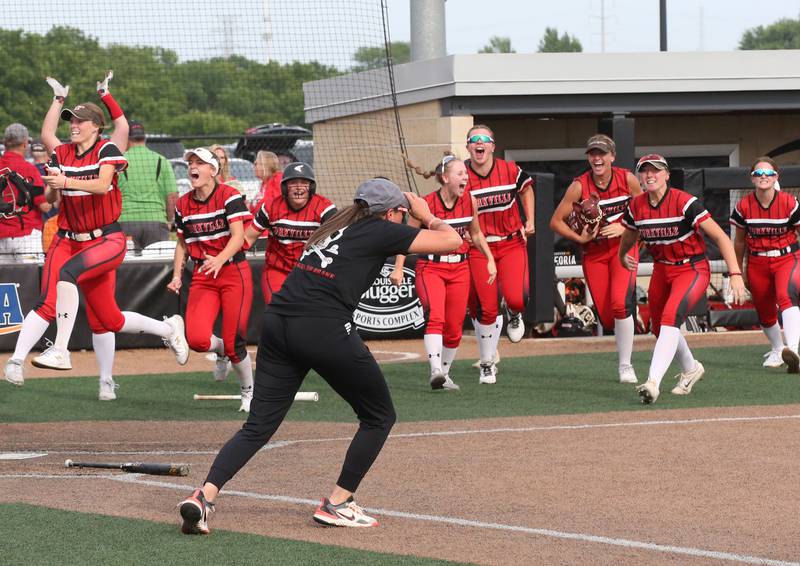 Members of the Yorkville softball team react while pouring out of the dugout after defeating Oak Park-River Forest in thirteen innings during the Class 4A State semifinal softball game on Friday, June 9, 2023 at the Louisville Slugger Sports Complex in Peoria.