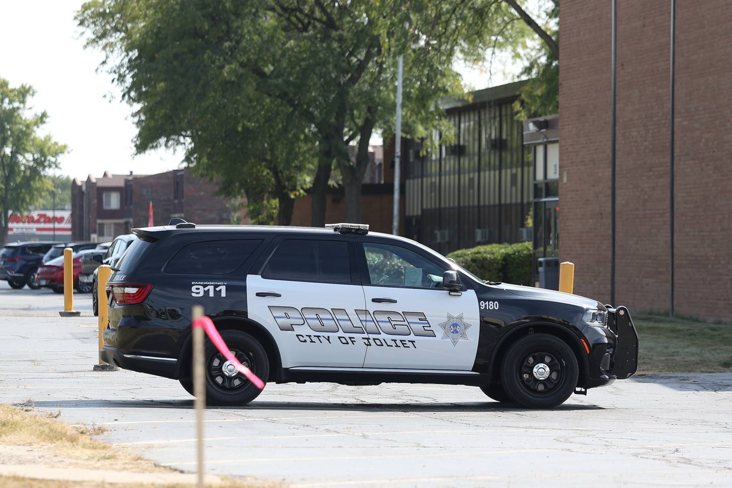 A Joliet police vehicle sits outside Hufford Junior High School on Monday, Sept. 16, 2024 in Joliet.