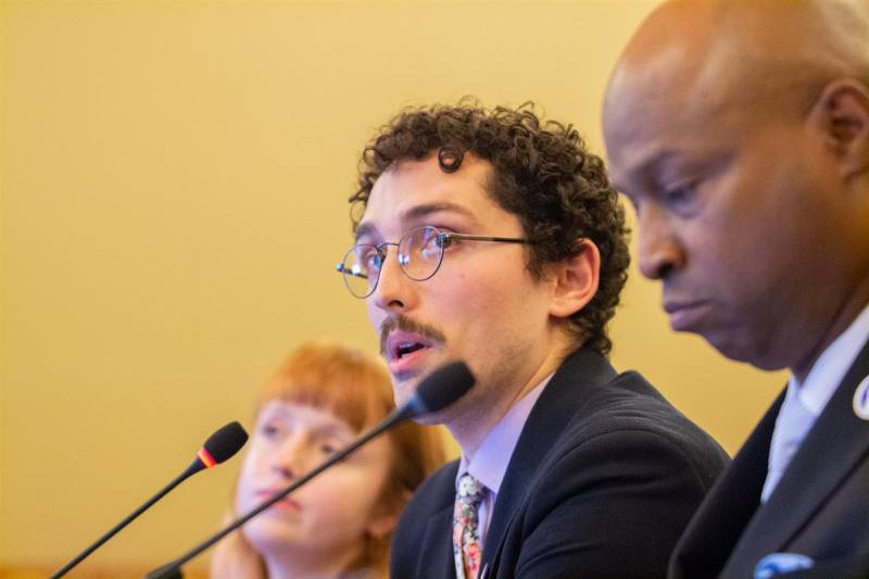 Brady Burden, a member of the Illinois Legislative Staff Association organizing committee, is pictured with House Speaker Emanuel “Chris” Welch in an October 2023 committee hearing.