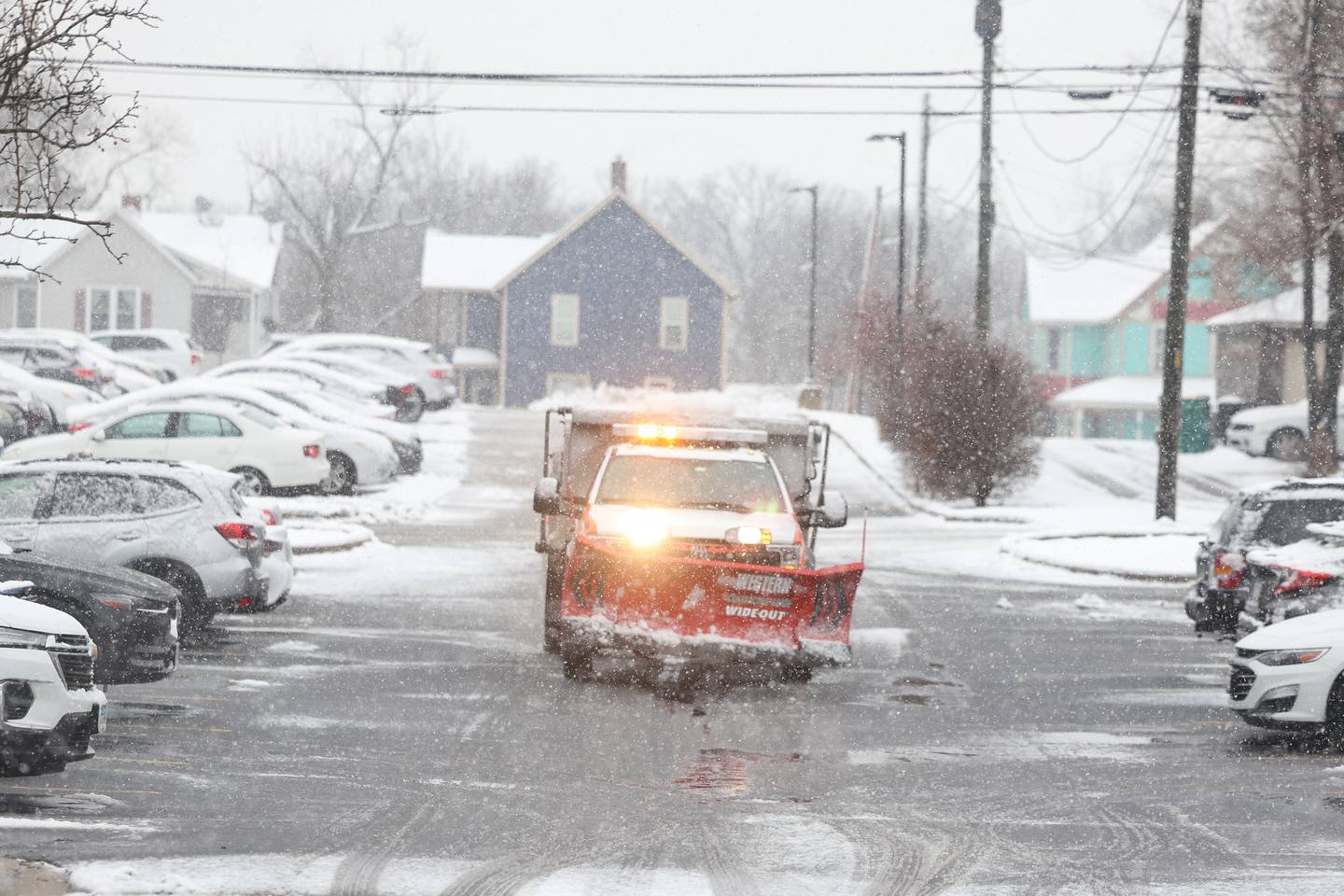 A truck salts the parking lot of University of St. Francis on Tuesday, Jan. 9th, 2024 in Joliet.