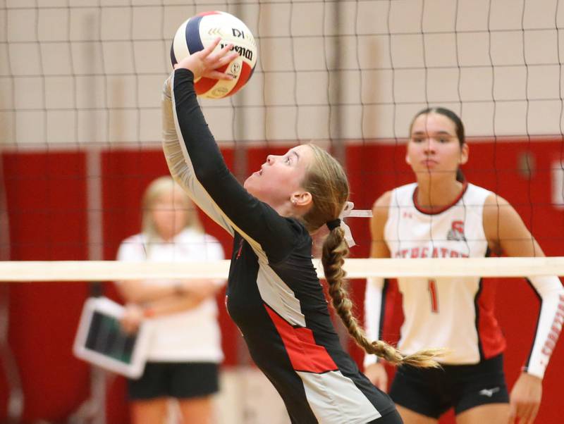 Woodland's Ella Derossett sets the ball in the air against Streator on Monday, Aug. 26, 2024 at Streator High School.