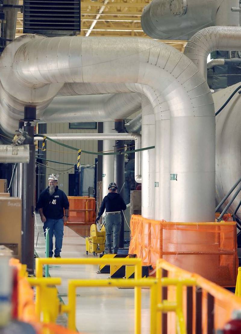 Employees navigate through the steam turbine area of the Byron Generating Station Tuesday, Oct. 17, 2023, in Byron.