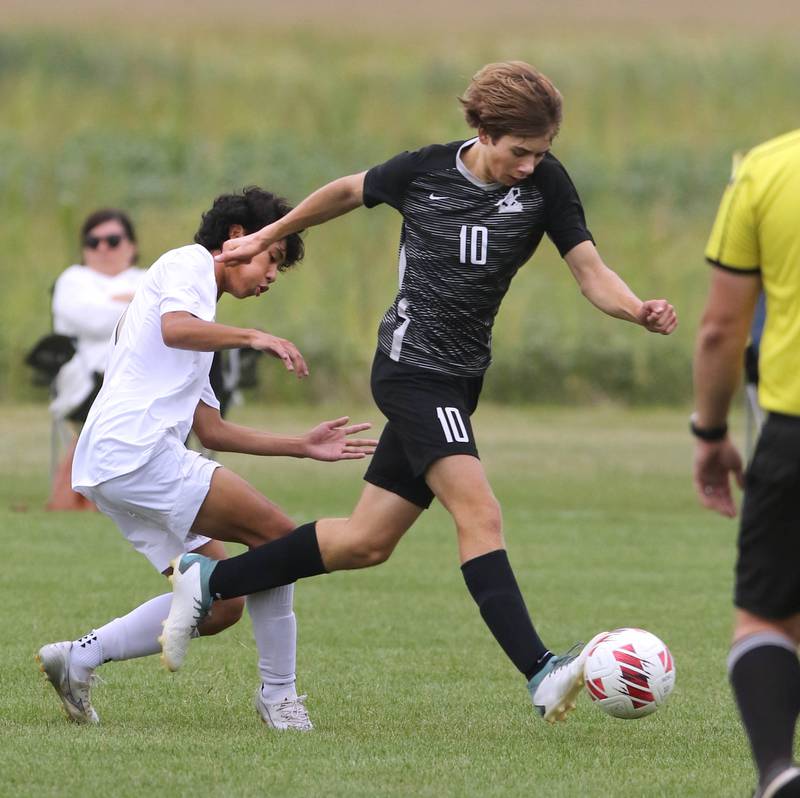 Kaneland's Jackson Boryc gets by Sycamore's Noah Daykin during their game Wednesday, Sept. 6, 2023, at Kaneland High School in Maple Park.