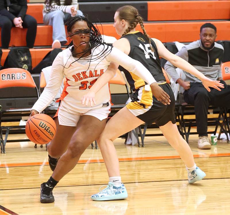 DeKalb’s Cayla Evans goes baseline against Metea Valley's Kelly Clish during their game Friday, Jan. 19, 2024, at DeKalb High School.