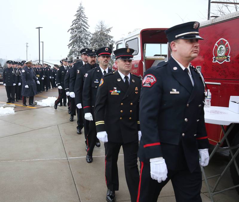 Firefighters from all around the area file in Saturday, Jan. 6, 2024, to the visitation for Sycamore firefighter/paramedic Bradley Belanger at the Sycamore Park District Community Center. Belanger, 45, who worked with the Sycamore Fire Department for more than two decades, died Friday, Dec. 22, after a yearlong battle with cancer.