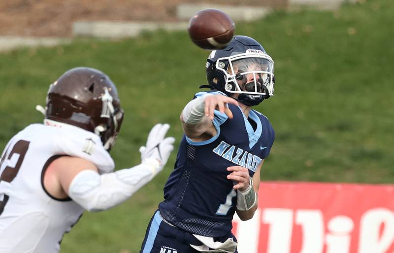 Nazareth's Logan Malachuk makes a throw as Joliet Catholic players drop into coverage during their 2023 Class 5A state championship game in Hancock Stadium at Illinois State University in Normal.