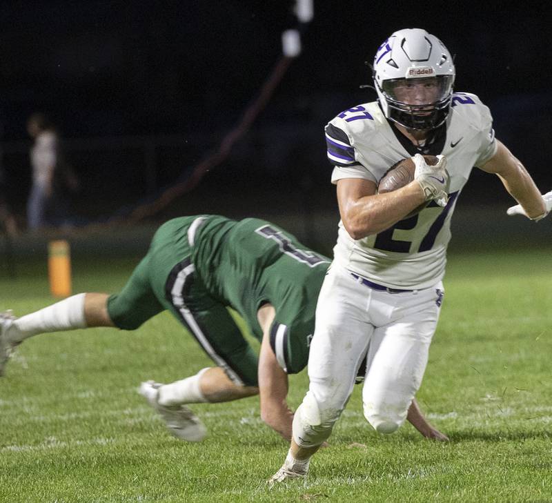 Dixon’s Eli Davidson breaks a tackle against Rock Falls Friday, Sept. 13, 2024, at Hinders Field in Rock Falls.