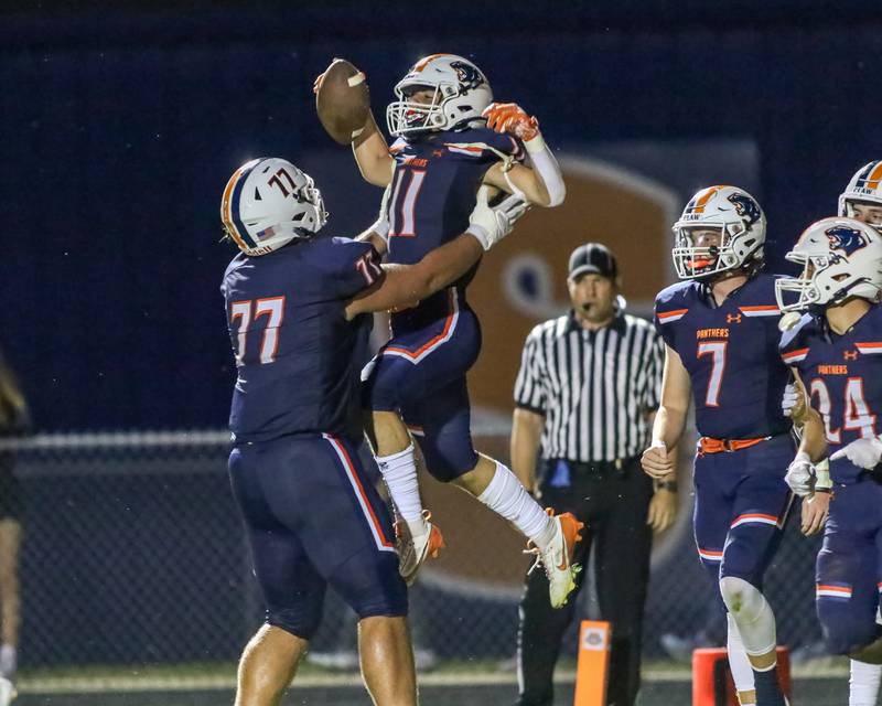 Oswego's Teddy Manikas (11) celebrates a touchdown during a football game between Neuqua Valley and Oswego on Friday, Aug. 30, 2024 in Oswego. Gary E Duncan Sr for Shaw Local News Network.