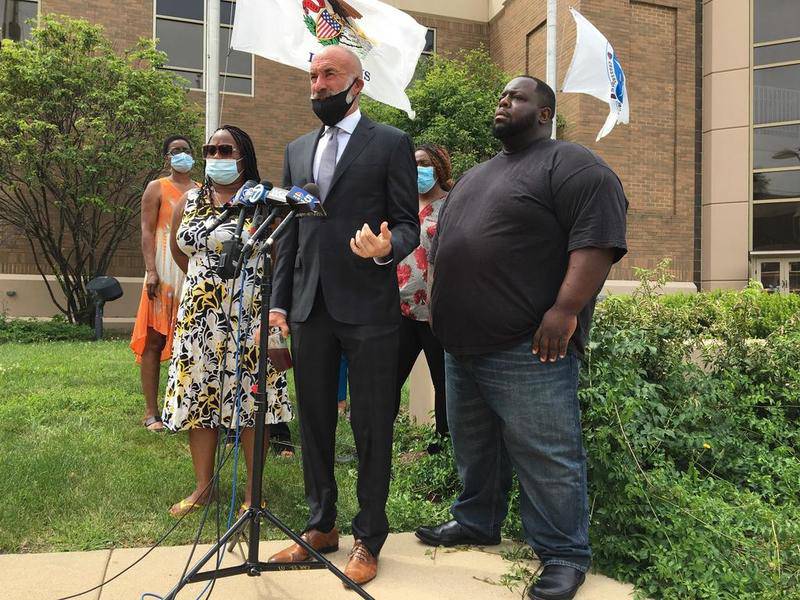 Eric Lurry Jr.'s widow Nicole Lurry (left), attorney Michael Oppenheimer and activist Victor "Stringer" Harris at a news conference on July 15, 2020 at the Joliet Police Department.