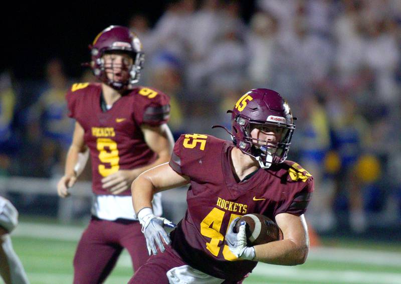 Richmond-Burton’s Riley Shea runs the ball against Johnsburg in varsity football action on Friday, Sept. 13, 2024, at Richmond-Burton High School in Richmond.