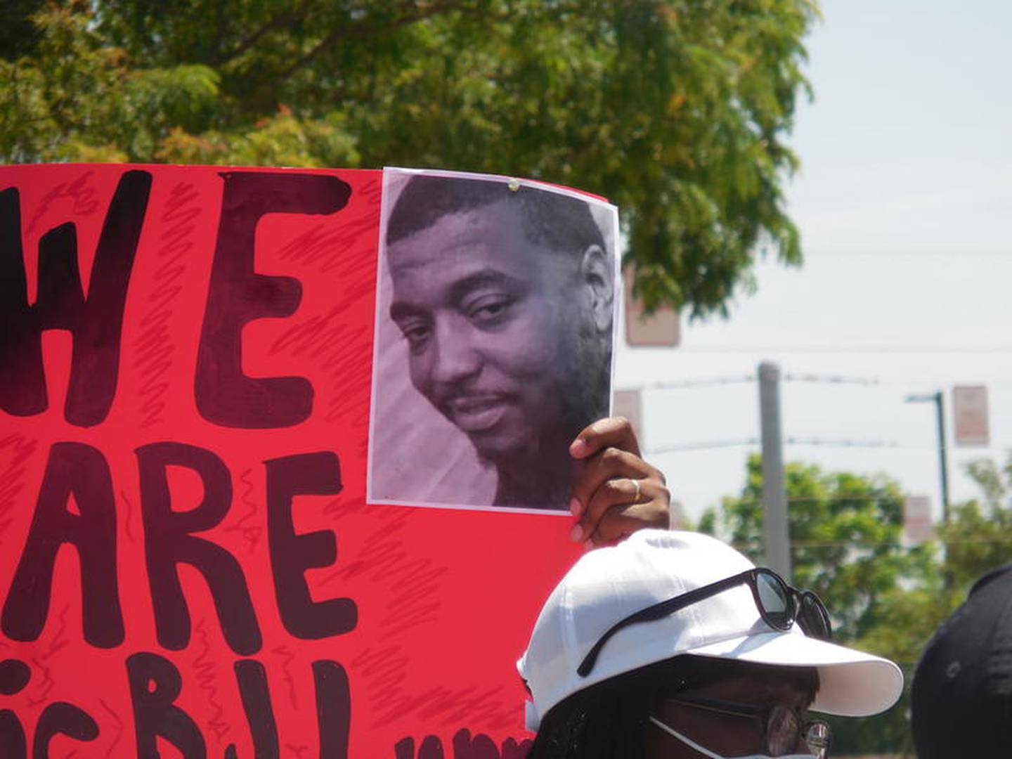 Demonstrators protested the death of Eric Lurry on Friday outside the Joliet Police Department.