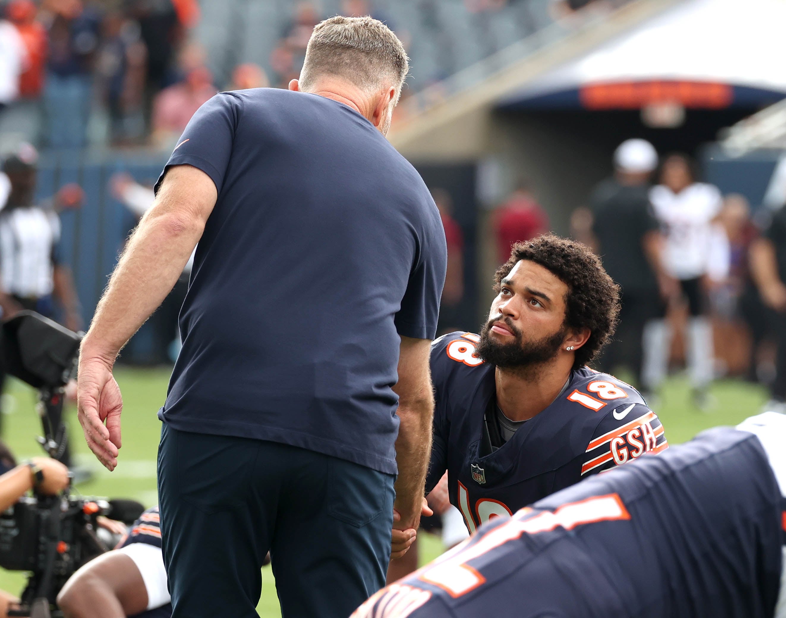 Chicago Bears quarterback Caleb Williams shakes hands with head coach Matt Eberflus before their game with the Cincinnati Bengals Saturday, Aug. 17, 2024, at Soldier Field in Chicago.