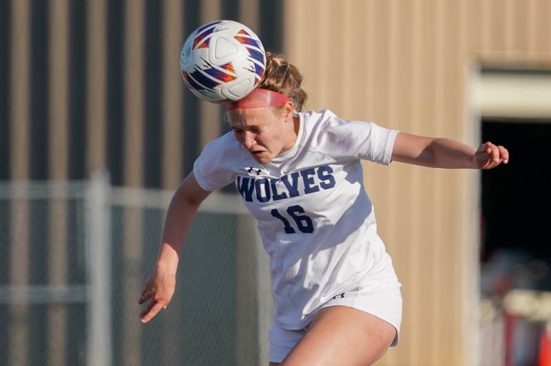 Oswego East's Catie Sloan (16) heads the ball against Oswego during a Class 3A Lockport Regional semifinal soccer match at Lockport High School in Lockport on Wednesday, May 15, 2024.