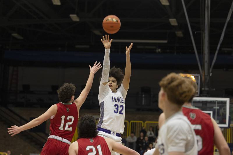 Dixon’s Darius Harrington puts up a three-point shot late in the game against LaSalle-Peru Wednesday, Feb. 21, 2024 at the Sterling class 3A basketball regional.