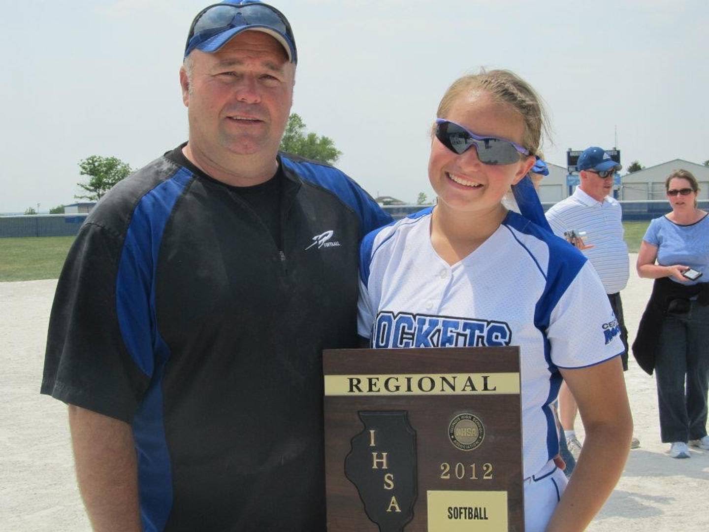 Bill Morrow poses with his daughter Angela after winning a Class 3A regional championship with Burlington Central in 2012. Murrow, who previously served as a volunteer assistant with the Rockets, was named Central's coach earlier this month.