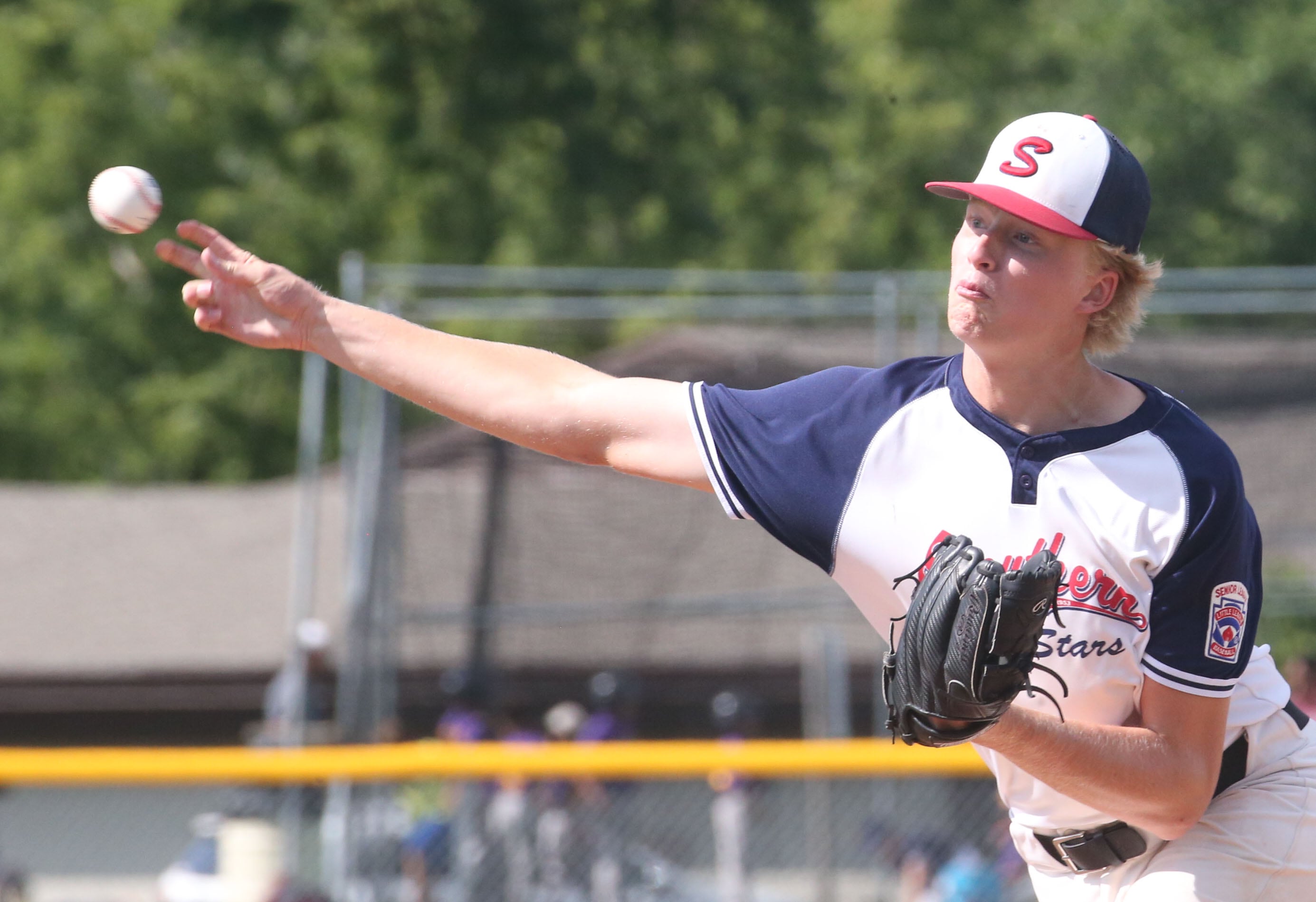 Michigan's Will Doezema lets go of a pitch to Burbank during the Central Regional  Baseball Tournament championship on Thursday, July 18, 2024 at J.A. Happ Field in Washington Park in Peru.