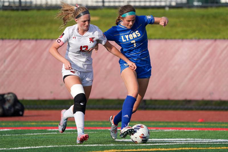 Lyons’ Caroline Mortonson (7) plays the ball against Hinsdale Central's Claire Snodgrass (12) during a Class 3A Hinsdale Central Sectional semifinal soccer match at Hinsdale Central High School in Hinsdale on Tuesday, May 21, 2024.