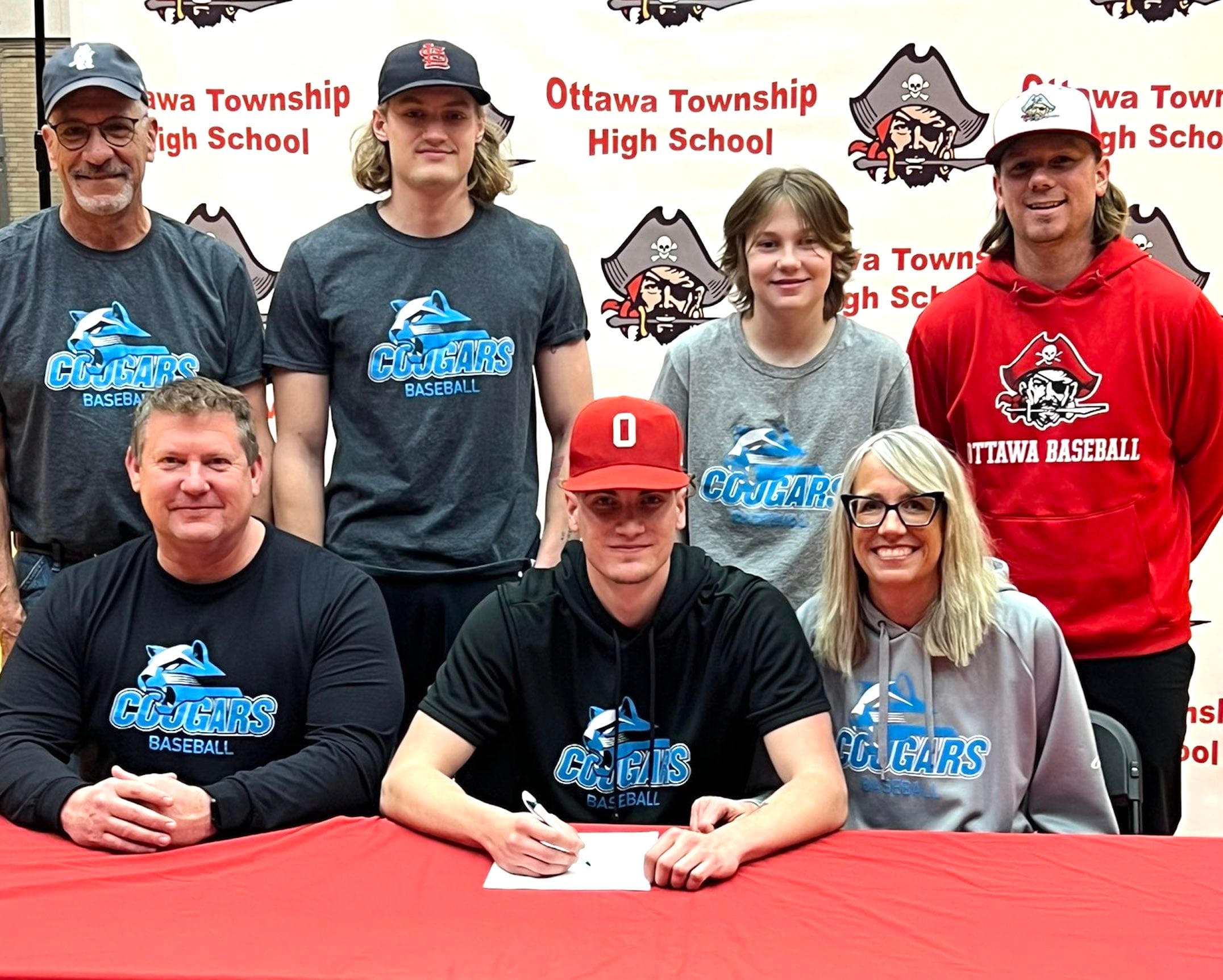 Ottawa’s Tate Wesbecker has signed to continue his education at Kalamazoo Valley Community College in Kalamazoo, Michigan, and his baseball career at the NJCAA level with the Cougars. Wesbecker, a pitcher and first-team member of the 2024 Times All-Area Baseball Team, is pictured at his signing ceremony surrounded by family and former Ottawa baseball coach Tyler Wargo (standing at far right).