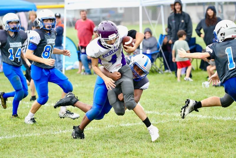 Princeton eighth grader Isiah Bellany makes the tackle against Rochelle Saturday.