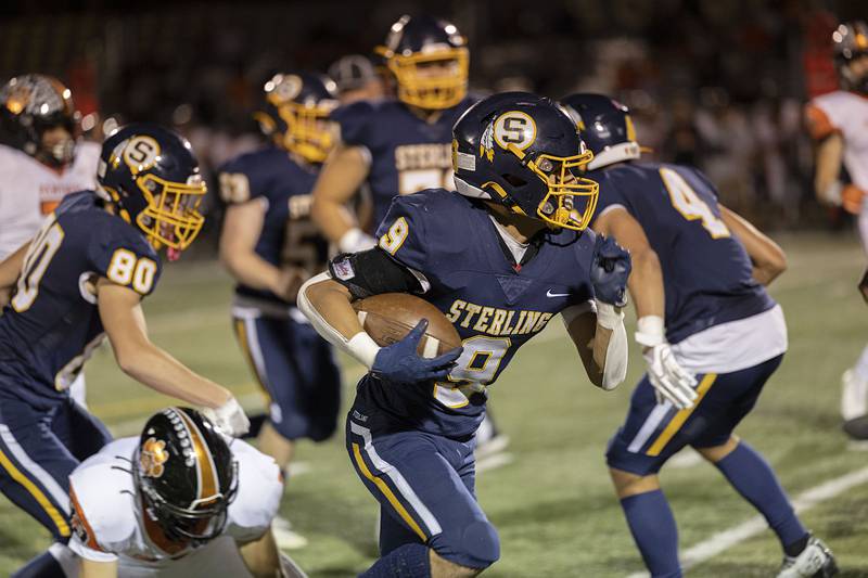 Sterling’s AJ Kested breaks through the line on way to a touchdown Friday, Oct. 21, 2022 against United Township.