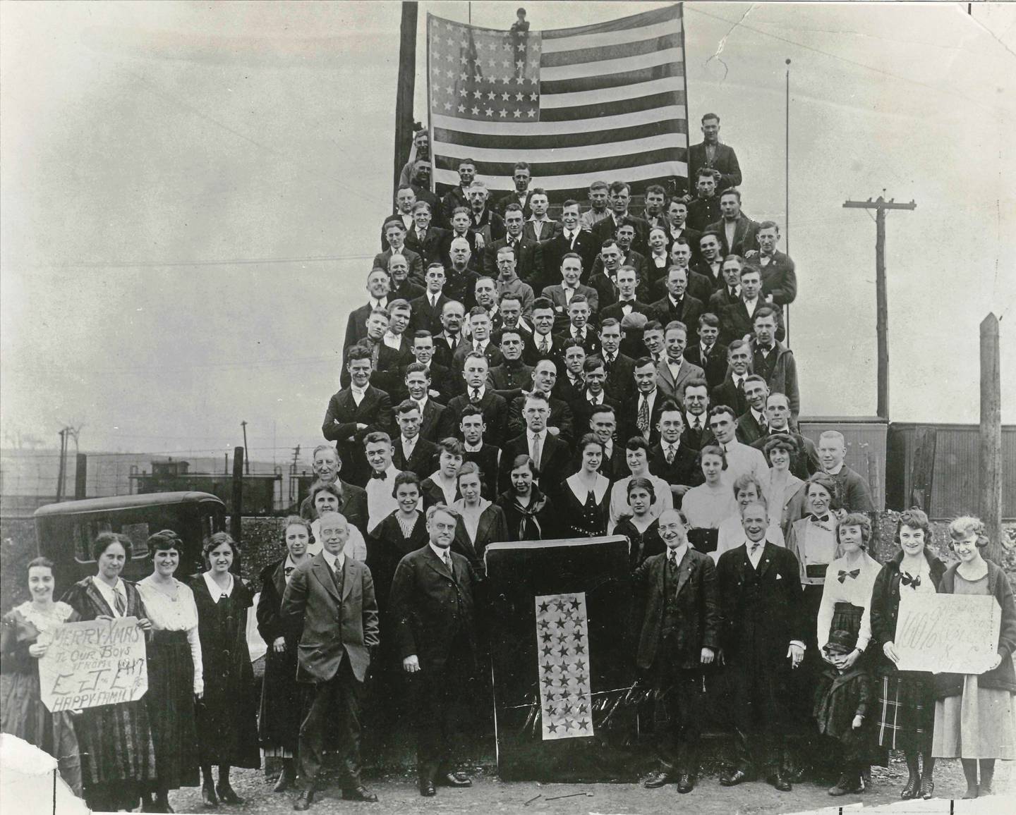 The workers at the E J & E railroad wishing the boys in service a Merry Christmas in 1917.
