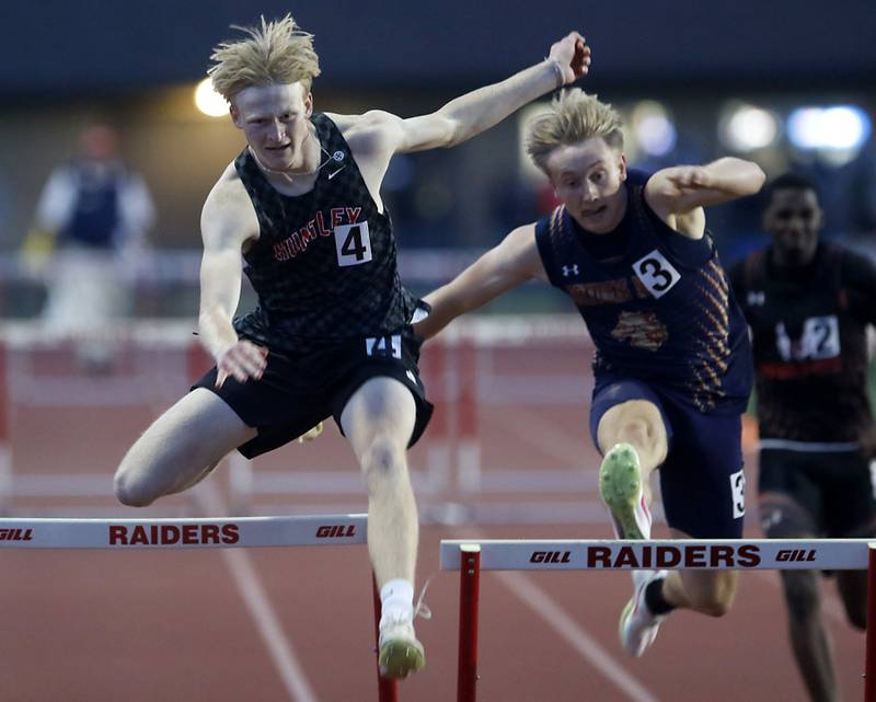 Huntley’s Ryan Schroeder goes over the last hurdle in front of Belvidere North’s Joseph Brown as the compete in the 300 meter hurdles during the Huntley IHSA Class 3A Boys Sectional Track and Field Meet on Wednesday, May 15, 2024, at Huntley High School.