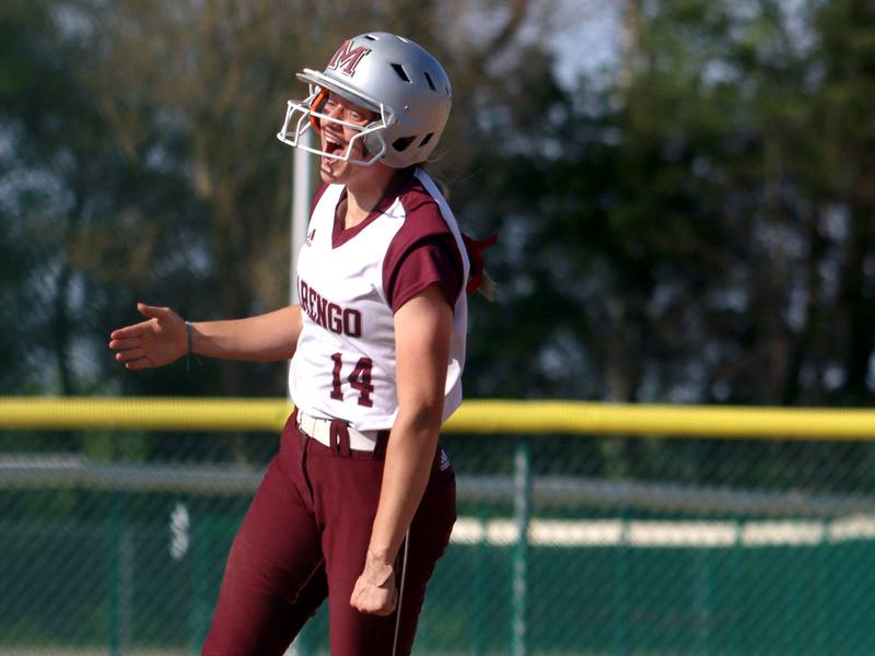 Marengo’s Kylee Jensen celebrates as she is along for the ride on a Gabby Christopher home run against North Boone in IHSA Softball Class 2A Regional Championship action at Marengo Friday.