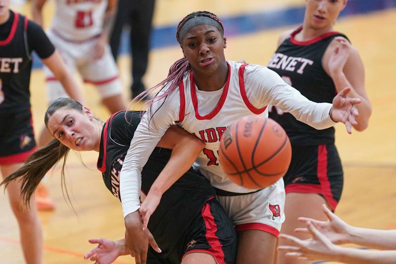 Benet’s Magdalena Sularski (33) and Bolingbrook's Trinity Jones (10) fight for a rebound during a Oswego semifinal sectional 4A basketball game at Oswego High School on Tuesday, Feb 20, 2024.