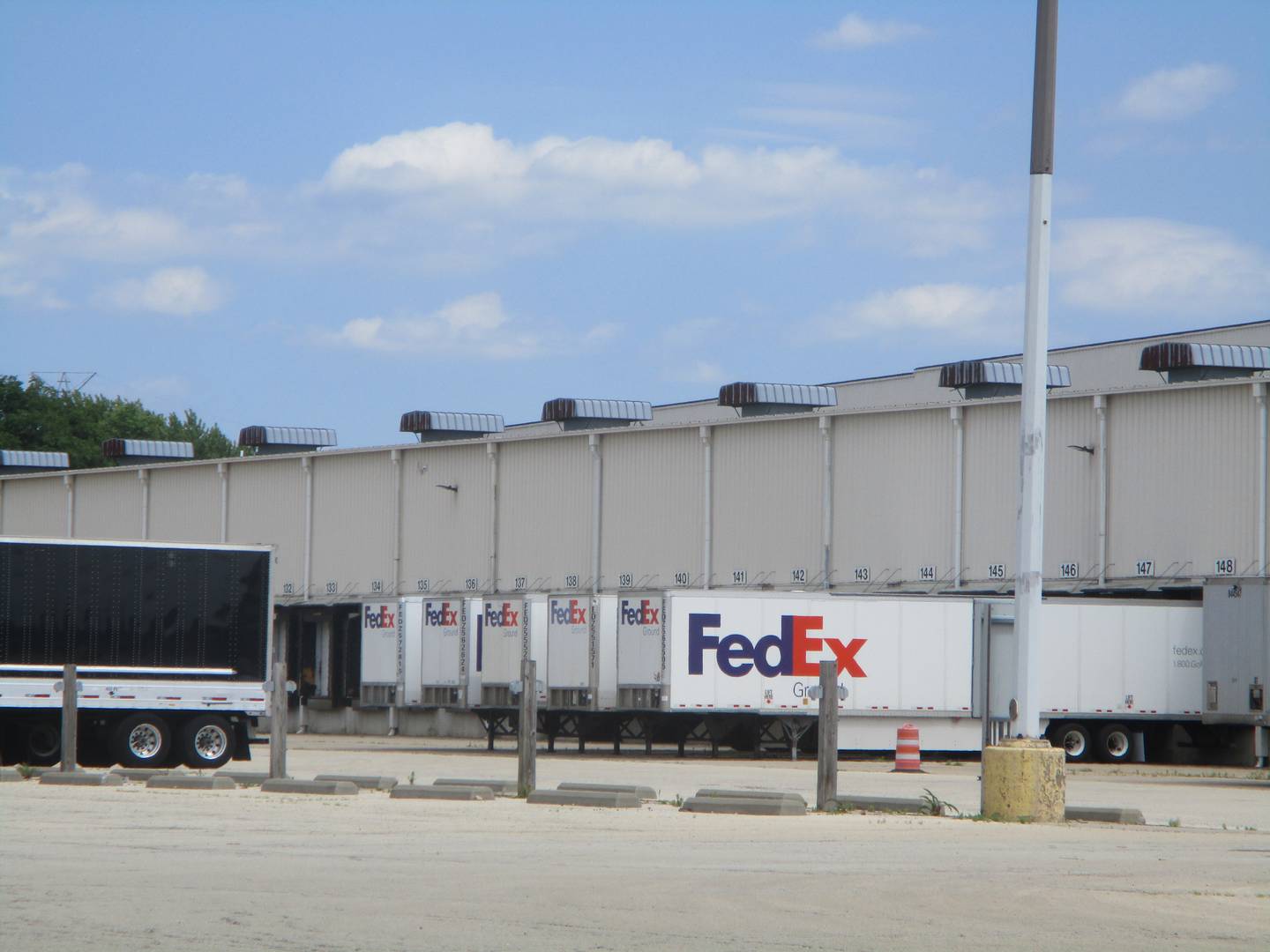 Truck containers are lined up at the former Toys 'R Us warehouse, which is kitty corner from the Division Street site in Joliet where MWI Property Group wants to build a warehouse and possible assembly plant. June 24, 2024