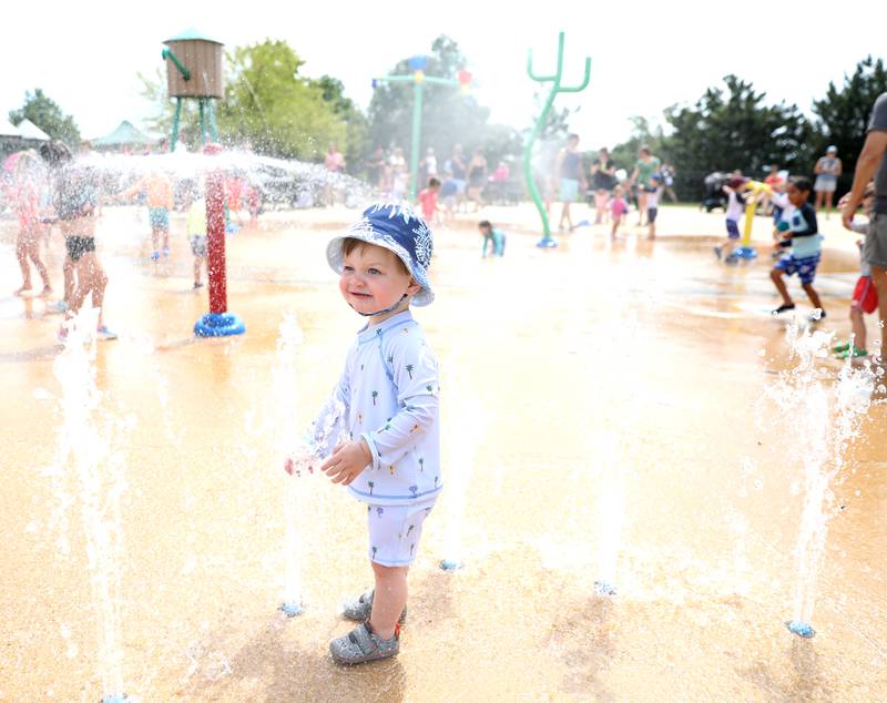 Zachary Atkinson, 21 months, plays in the water at the Maryknoll Splash Park in Glen Ellyn on Saturday, June 15, 2024.