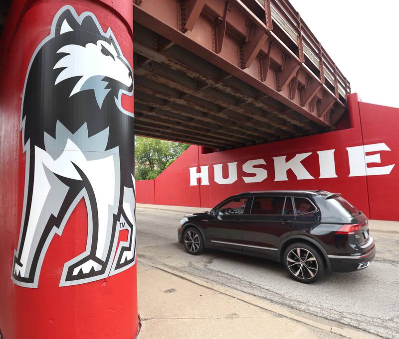 A vehicle drives by the new Huskie mural Monday, Aug. 7, 2023, on the Annie Glidden Road railroad underpass, just south of Lincoln Highway in DeKalb. The mural was a joint project between the City of Dekalb and Northern Illinois University.