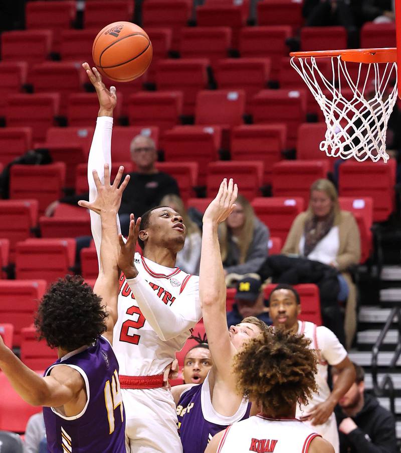 Northern Illinois Huskies guard Zarique Nutter shoots over an Albany defender during their game Tuesday, Dec. 20, 2022, in the Convocation Center at NIU in DeKalb.