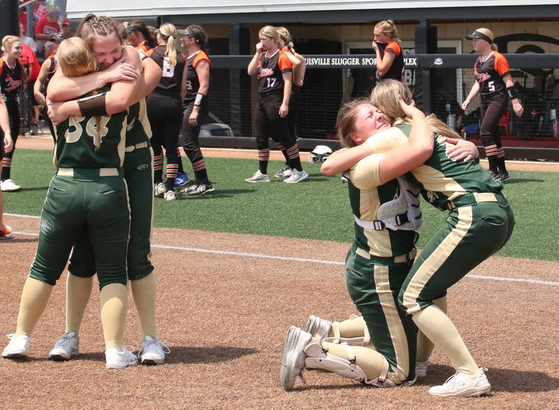 (From left) St. Bede's Tessa Dalton, Maddy Dalton, Bella Pinter and Ella Hermes celebrate behind home plate after winning the Class 1A State championship over Illini Bluffs on Saturday, June 3, 2023 at the Louisville Slugger Sports Complex in Peoria.