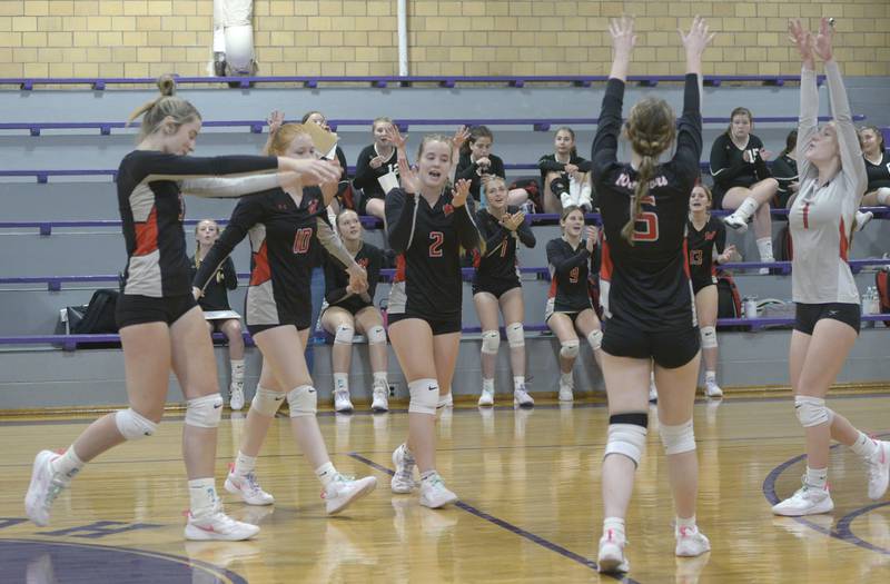 The Woodland Warriors celebrate their come from behind first set victory over Serena Tuesday at Serena.