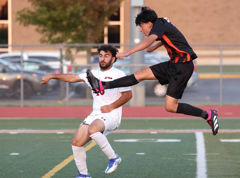 DeKalb's Joaquin Medina-Benitez follows through on a shot in front of Rockford East's Oday Alhariri during their game Thursday, Sept. 12, 2024, at DeKalb High School.