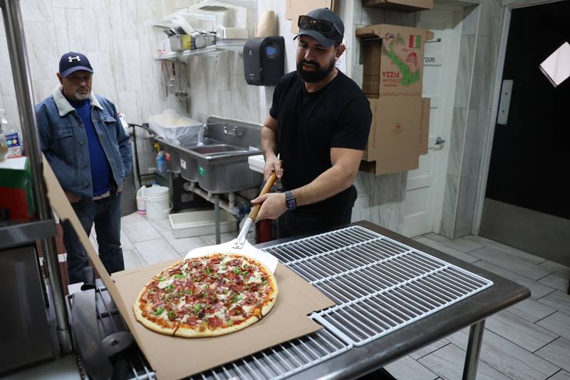 Manny Serma, owner of Sopranos Pizzeria and Catering, prepares an order on Thursday, Jan. 11th, 2024 in Lockport.