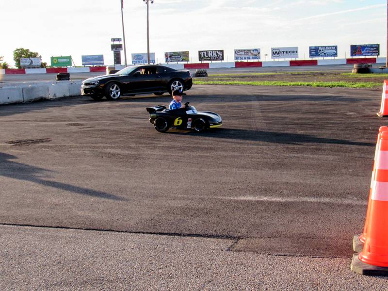 Lincoln Sontag approaches the finish line with a big lead during the Kids' Power Wheel race.