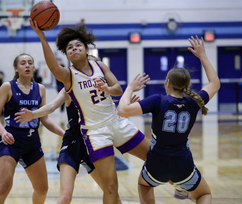 Downers Grove North’s Kaitlyn Parker (23) goes for a layup against Downers Grove South’s Megan Ganschow (10) during a Class 4A Downers Grove South Regional semifinal in Downers Grove, Ill. on Monday, Feb. 13, 2023.