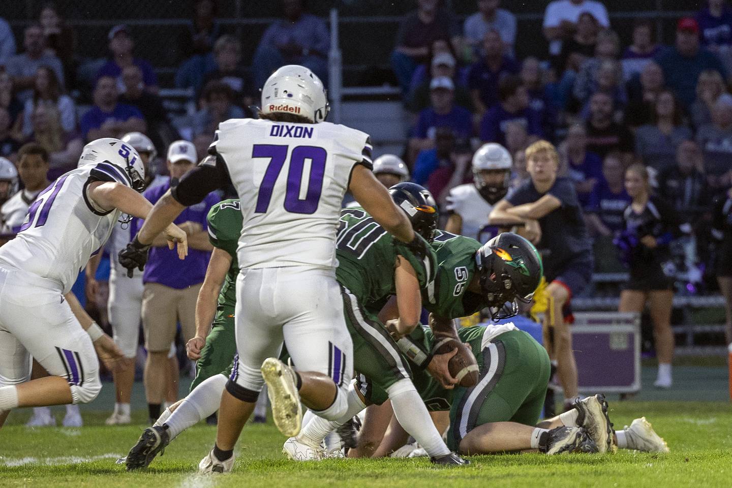 Rock Falls’ Isaac Duchay scoops a fumble against Dixon Friday, Sept. 13, 2024, at Hinders Field in Rock Falls.