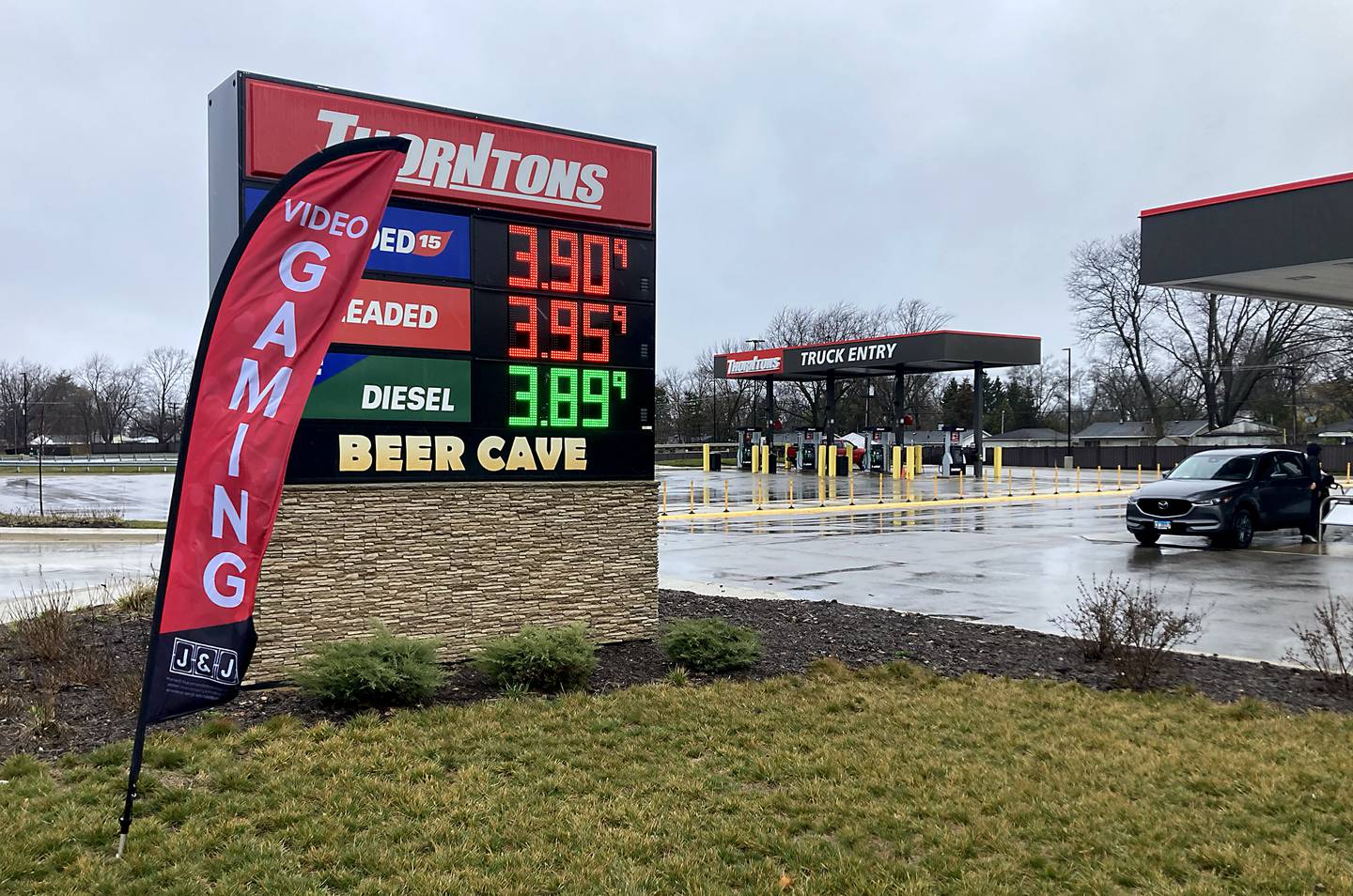 A gaming sign flies in front of the Thorntons sign in McHenry on Tuesday, April 2, 2024. The location recently received a video gaming license from the McHenry City Council to become the first truck stop in the community to offer video gaming.