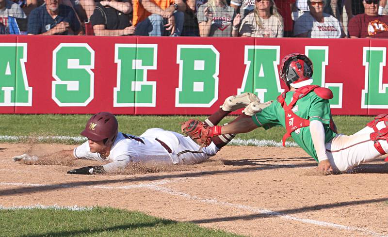 Morris's Colin Pfeifer dives across home plate as L-P catcher Seth Adams misses the tag during the Class 3A Regional semifinal game at Huby Sarver Field in La Salle.