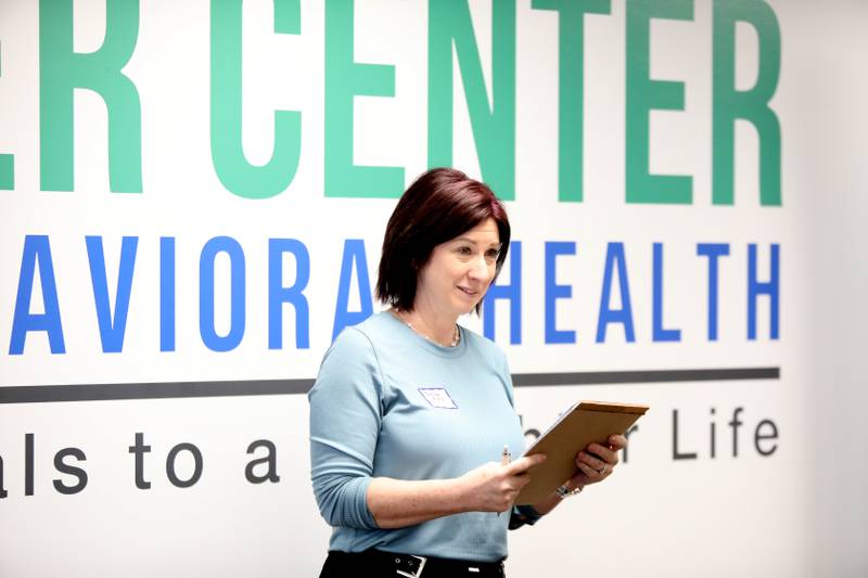 Jennifer Flory of Ecker Center for Behavioral Health, talks to partners from Rotary District 6440 after being presented a $5,000 grant aimed at enhancing mental health services. Rotary Clubs participating in the initiative include Elgin Breakfast Rotary Club, Rotary Club of Elgin (Noon), Batavia Illinois Rotary Club, Rotary Club of Bartlett, and St. Charles Breakfast Rotary Club.