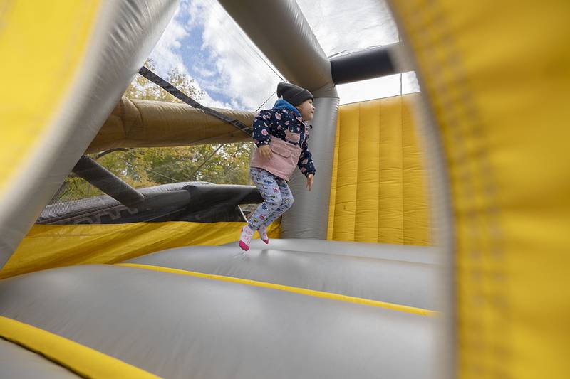 Nay’Elli Berge, 3, bounces around Sunday in the bouncy house. Older sister Ariella Ristau, 8, and younger sister A’Ryiah Berge, 10 months, with mom at the house.