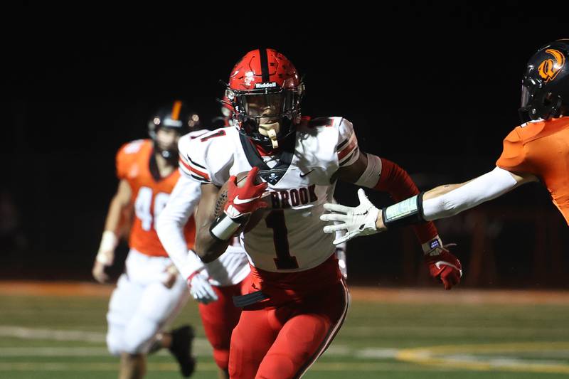 Bolingbrook’s Kyan Berry-Johnson runs after the catch against Lincoln-Way West on Friday, Sept. 22 in New Lenox.